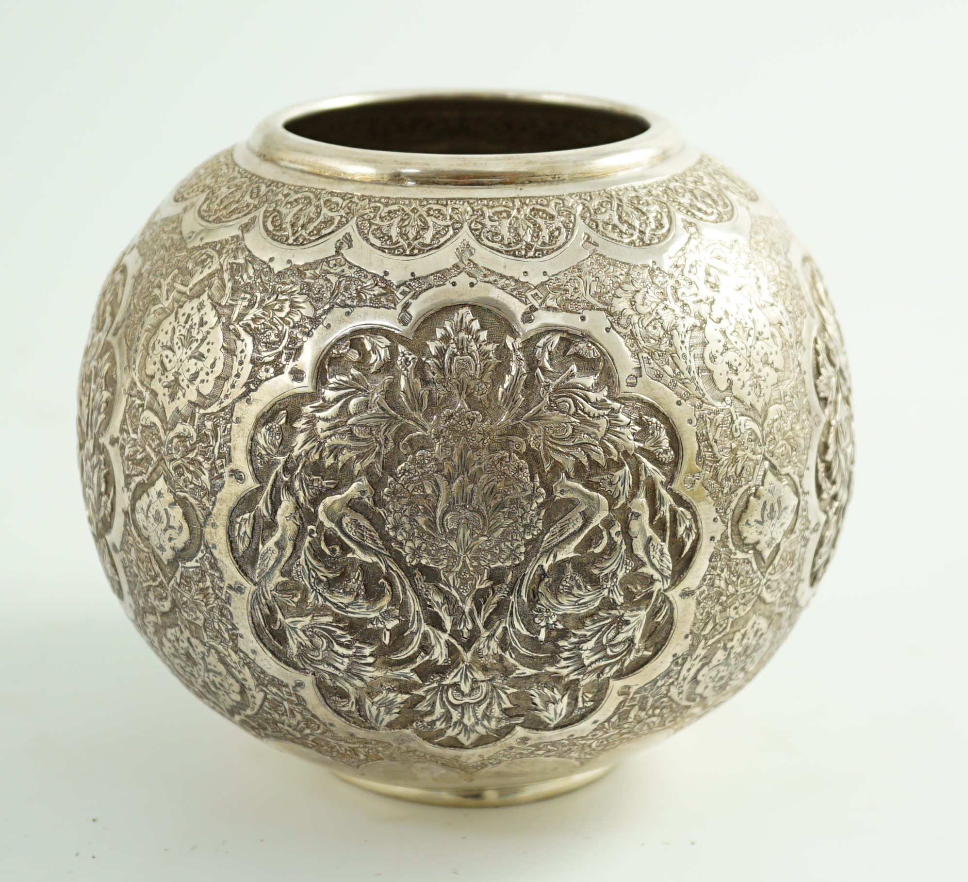 A 20th century Persian 84 standard embossed and engraved white metal vase, height 14cm, 17.4oz.